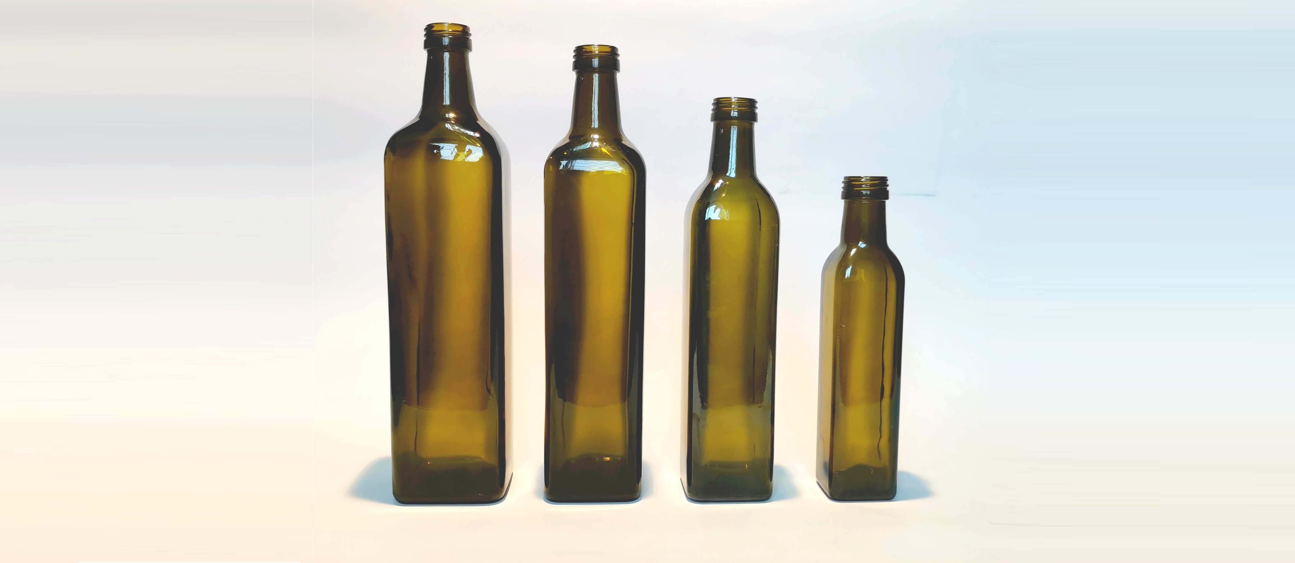 Olive-colored glass oil bottles